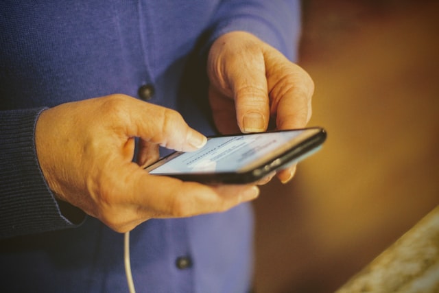 Person holding a device